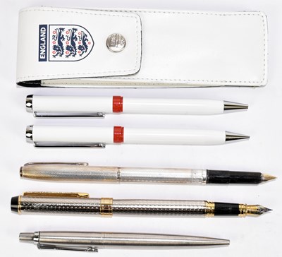 Lot 144 - A sterling silver fountain pen with engine...