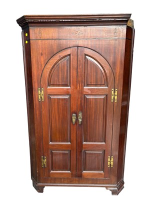 Lot 309 - A 19th century inlaid mahogany corner cupboard,...