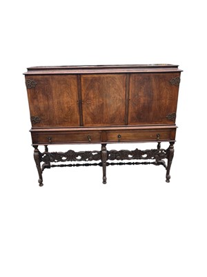 Lot 200 - A Continental walnut sideboard with three...