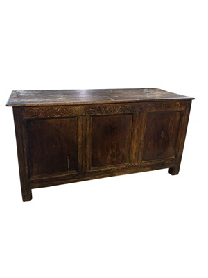 Lot 107 - An 18th century carved oak coffer, with...