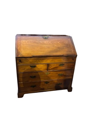 Lot 199 - A Georgian mahogany bureau, the fall front...