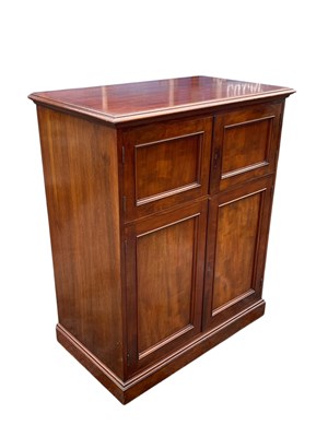 Lot 185 - A mahogany four door cabinet, on plinth base,...