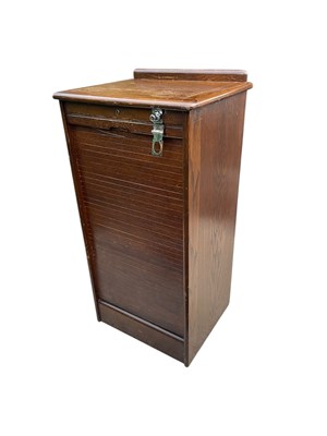 Lot 212 - A 20th century oak filing cabinet with tambour...