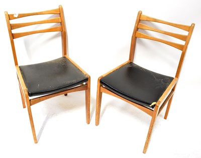 Lot 50 - Two 1970s oak framed bar-back dining chairs...