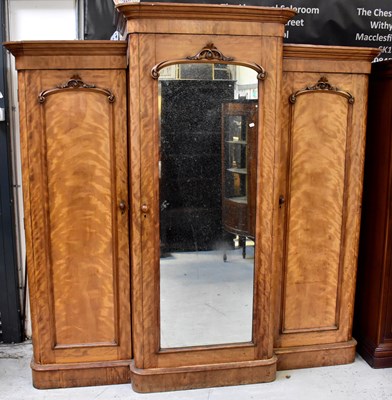 Lot 65 - A Victorian satinwood breakfront triple...