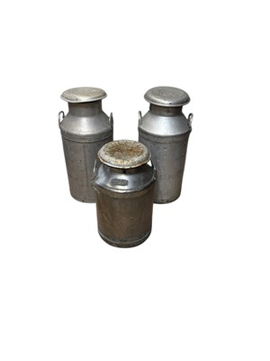 Lot 350 - Three vintage milk churns including two Nestle...