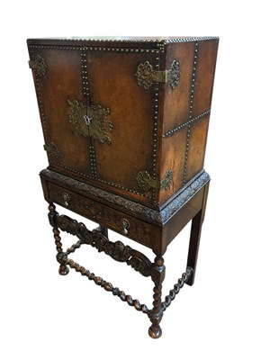 Lot 54 - An oak and studded leather drinks cabinet, the...