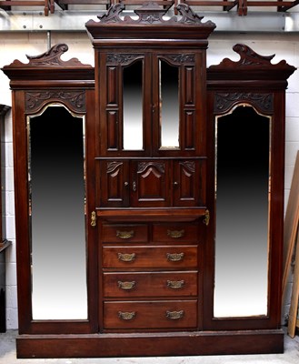 Lot 66 - An Edwardian mahogany triple breakfront...