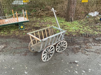 Lot 394 - A vintage wooden dog cart with metal strapping...