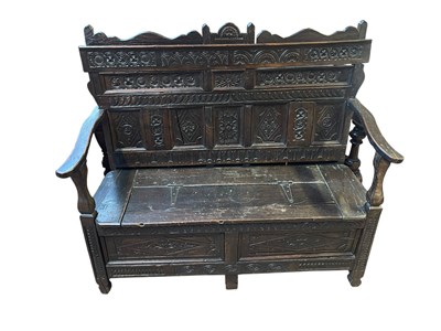 Lot 94 - An 18th century and later oak settle with...