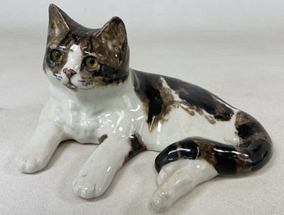 Lot 147 - WINSTANLEY; a large recumbent tabby cat with...