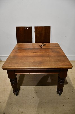 Lot 207 - A Victorian mahogany extending dining table on...