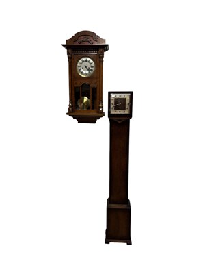 Lot 1265 - An early 20th century oak wall clock, with...