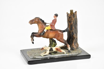 Lot 591 - A cold painted spelter table lighter modelled...