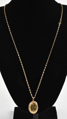 Lot 1451 - A 9ct gold oval locket, length 3cm, on a...