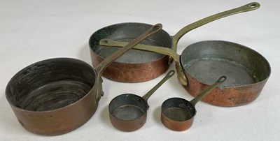 Lot 112 - Five graduated copper and brass skillet pans,...