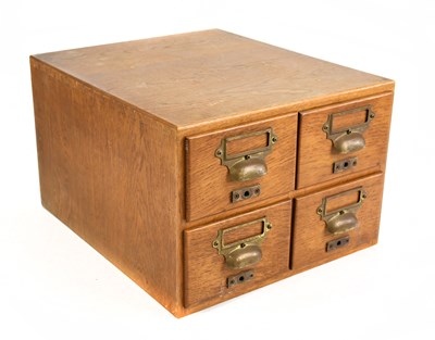 Lot 151 - An oak four drawer stationery cabinet, height...