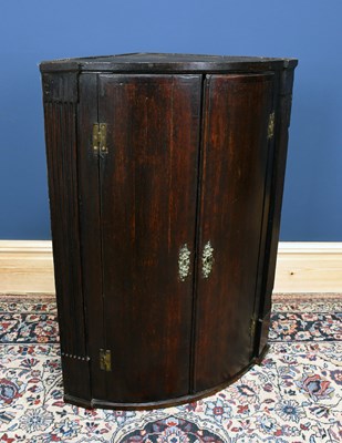 Lot 3000 - An 18th century hanging bowfront corner...