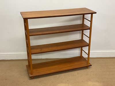 Lot 477 - A mid 20th century wooden open bookcase,...