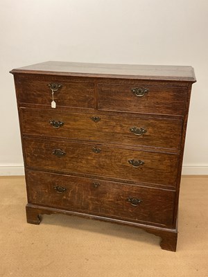 Lot 414 - An 18th century oak chest of two short over...