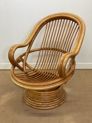 Lot 475 - A late 20th century bamboo swivel rocking...