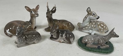 Lot 141 - ROYAL COPENHAGEN; group of six seated deer,...