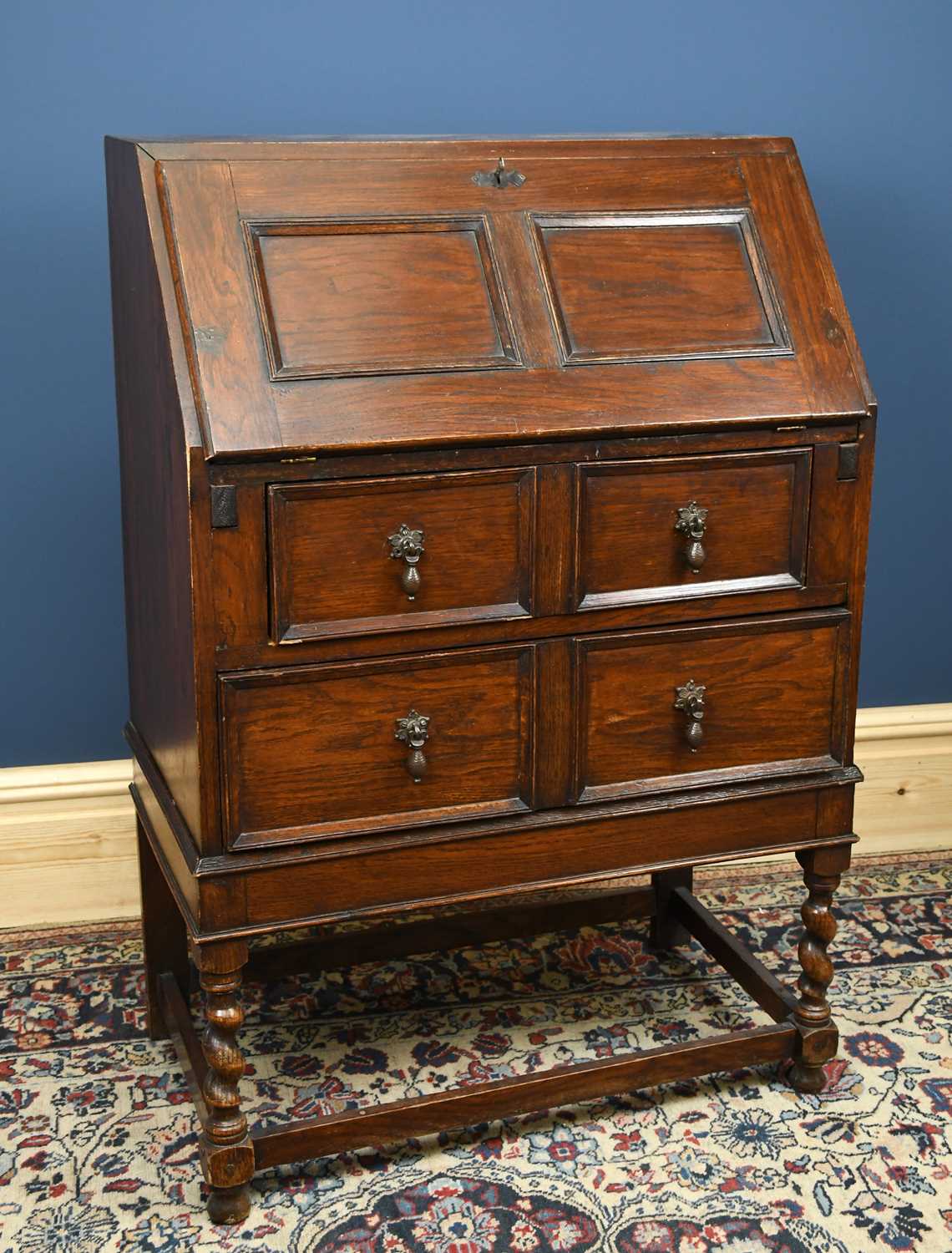 Lot 3073 - A reproduction Priory style oak bureau, width...