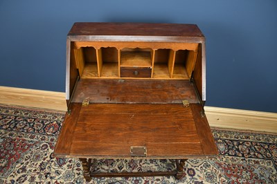 Lot 3073 - A reproduction Priory style oak bureau, width...