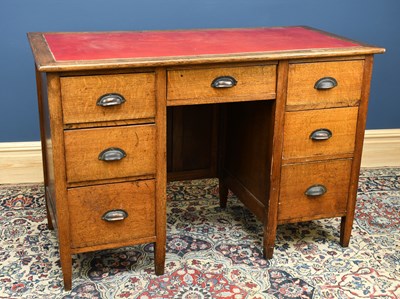 Lot 2973 - An early 20th century oak desk, with three...