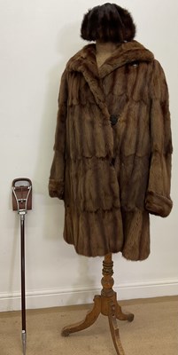 Lot 77 - A mid century fur coat, a mink trimmed hat and...