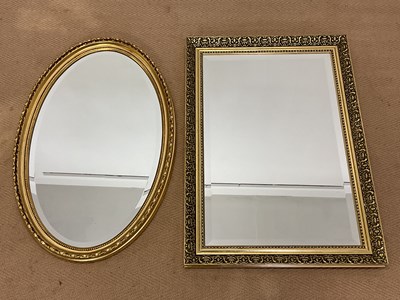 Lot 464 - Two modern gilt and bevelled framed mirrors,...