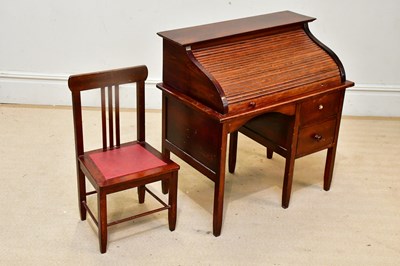 Lot 78 - A reproduction stained pine roll top child's...