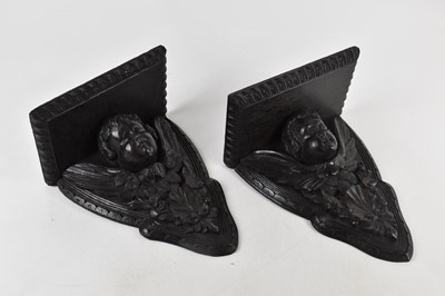 Lot 452 - A pair of carved oak wall brackets,...