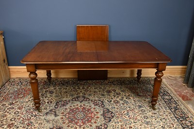 Lot 3052 - A reproduction mahogany extending dining table,...