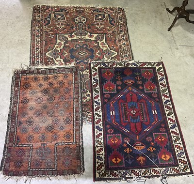 Lot 365 - Three Persian rugs. Largest measures 200 x 140cm.