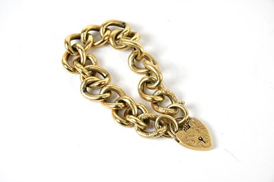 Lot 228 - A yellow metal curb link part textured...