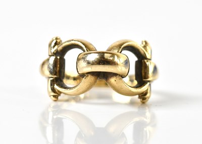 Lot 195 - A 9ct yellow gold horse bit ring, size J,...