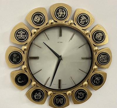 Lot 334 - METAMEC; a mid century 'Zodiac' wall clock...