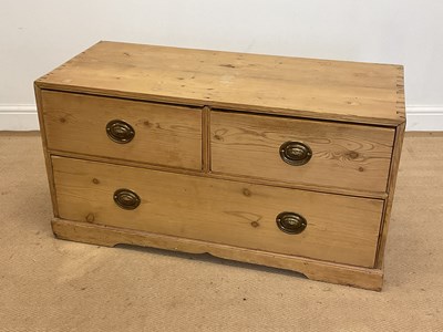 Lot 499 - A pine low chest of two short and one long...