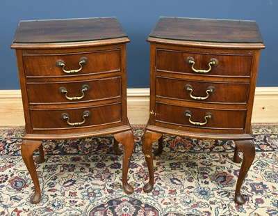 Lot 3053 - A pair of 1950s mahogany bowfront chests of...