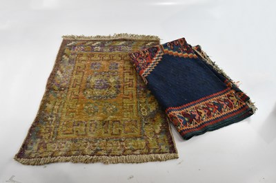 Lot 334 - An Eastern style rug decorated with three...