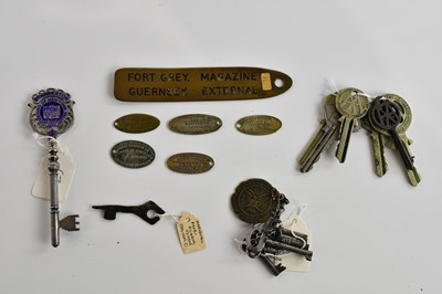 Lot 573 - A collection of assorted keys and tags,...