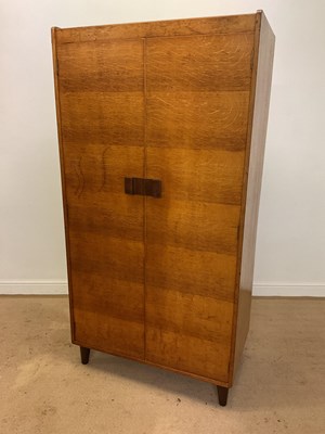 Lot 403 - GORDON RUSSELL; a light oak wardrobe with...