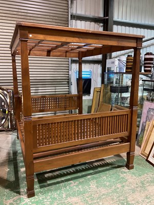 Lot 387 - A rustic solid teak four poster bed, height...