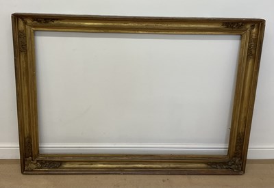 Lot 303 - A large gilt picture frame, with moulded...