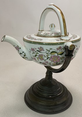 Lot 174 - WEDGWOOD; a floral decorated self pouring...