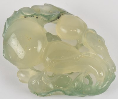 Lot 1039 - An early 20th century Chinese pale green jade...