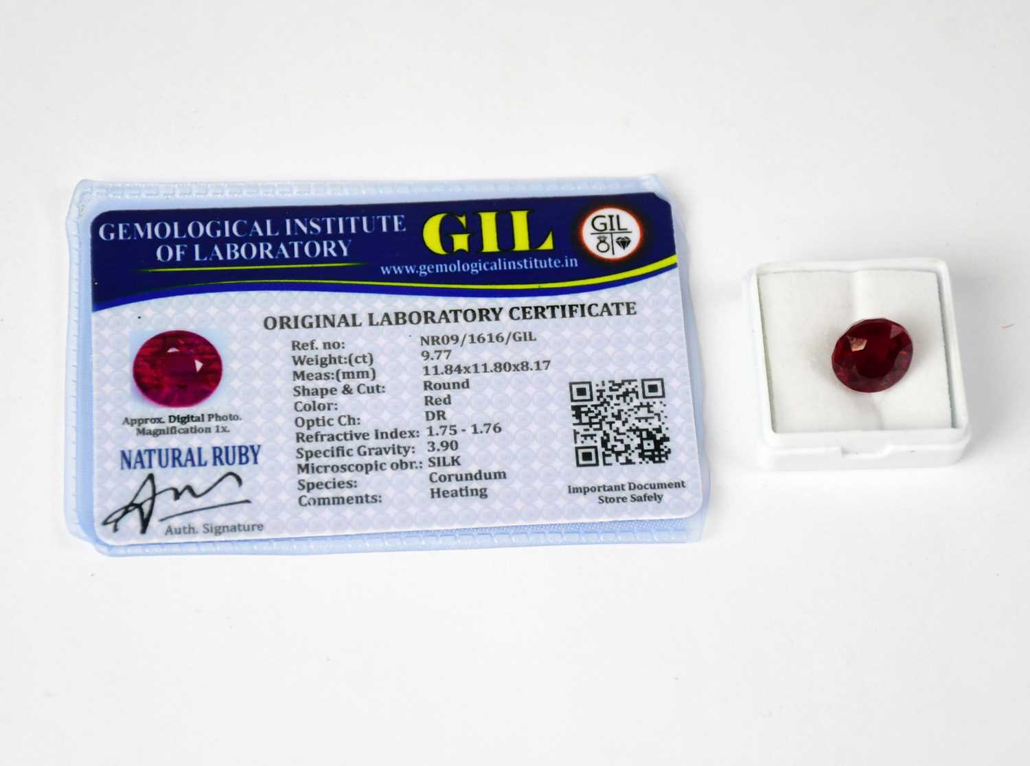 Lot 1250 - A loose 9.77 carat round ruby with GIL