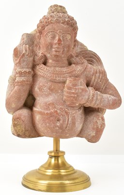 Lot 1009 - A red sandstone figure of Kubera, India,...