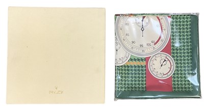 Lot 473 - ROLEX; a boxed silk scarf, decorated with...